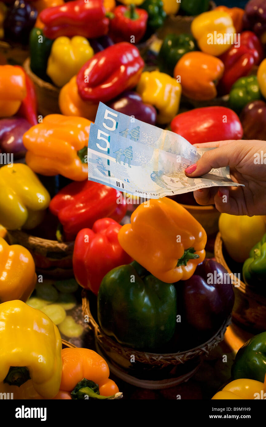 Canada, Quebec Province, Montreal, Jean Talon Market in Little Italy District, purchasing vegetables with Canadian dollars Stock Photo