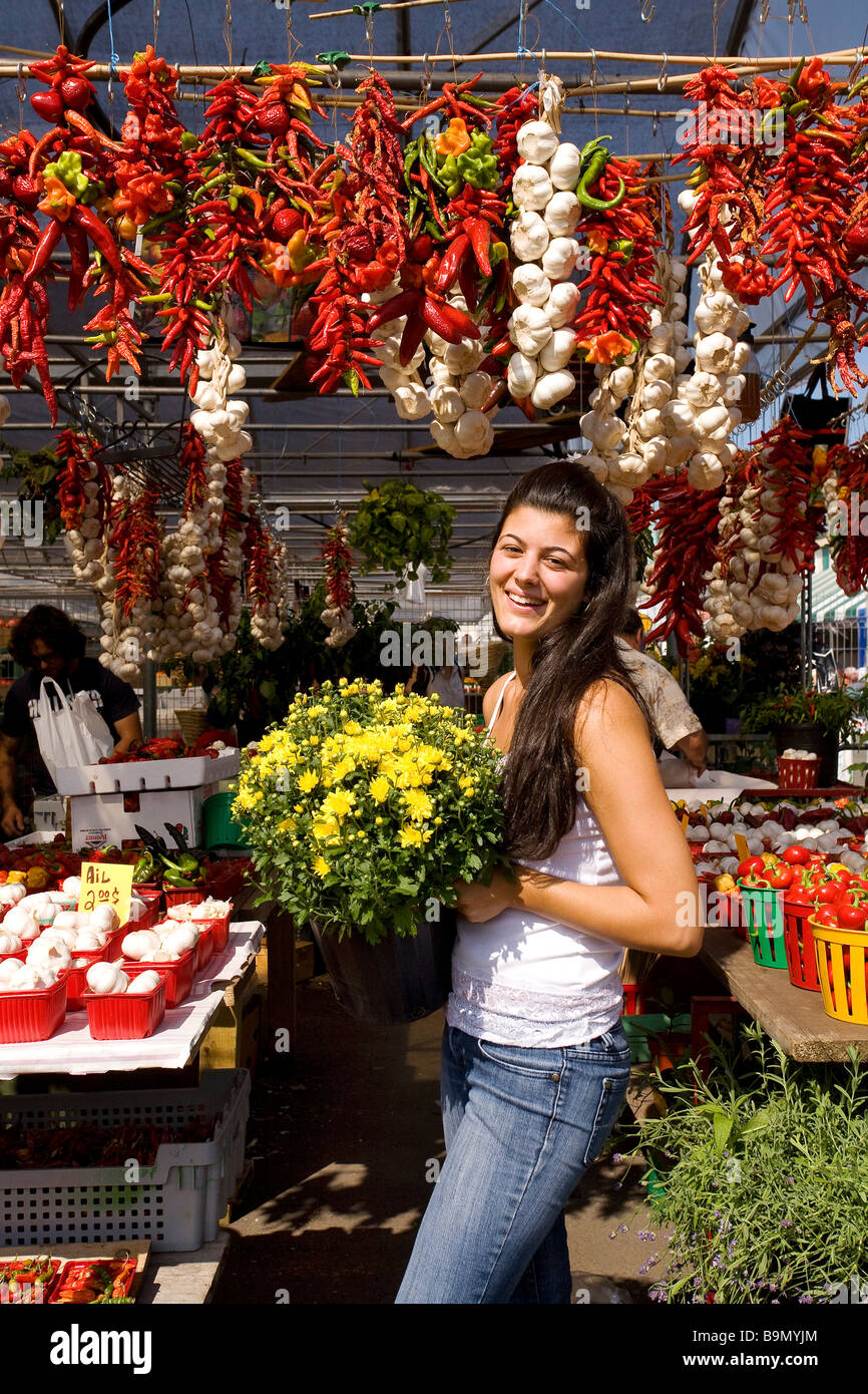 Canada, Quebec Province, Montreal, Jean Talon Market in Little Italy District, flowers and vegetables saleswoman Stock Photo