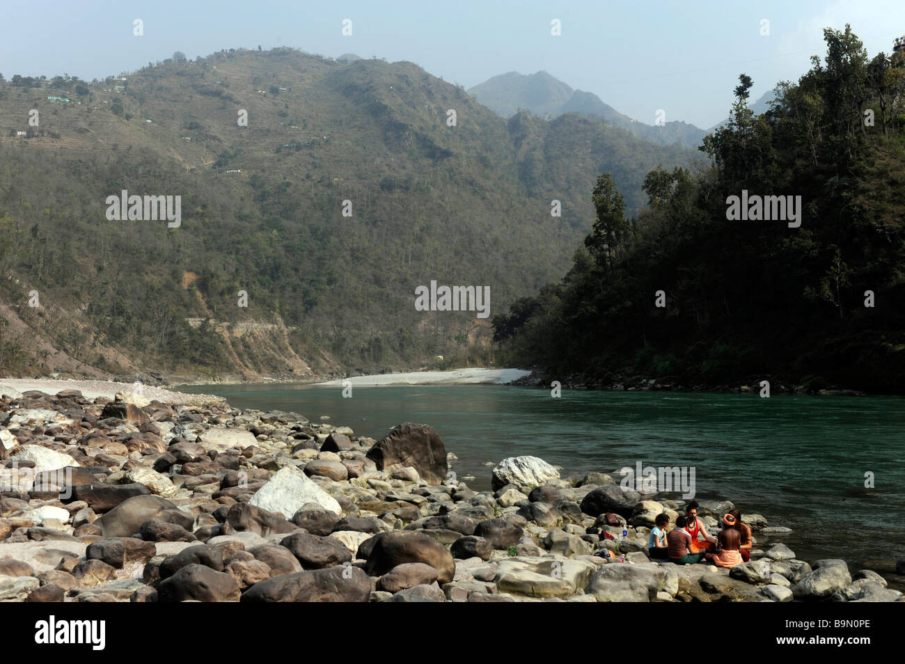 A group of people taking part in a meditation by the Ganges Shivpuri Uttaranchal, North India Stock Photo