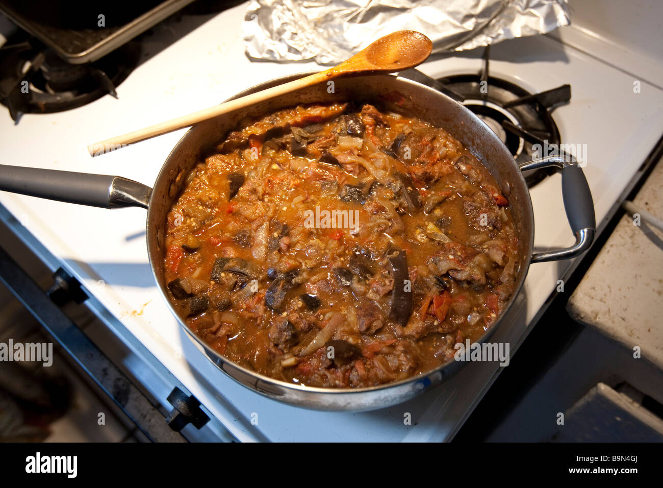 Lamb and eggplant stew in a saucepan on a stove in a kitchen Stock Photo Alamy