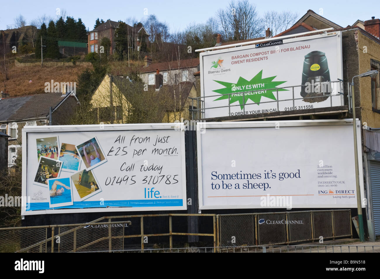 Multiple ClearChannel advertising billboards local council and ING Direct at Crumlin in South Wales Valleys UK Stock Photo