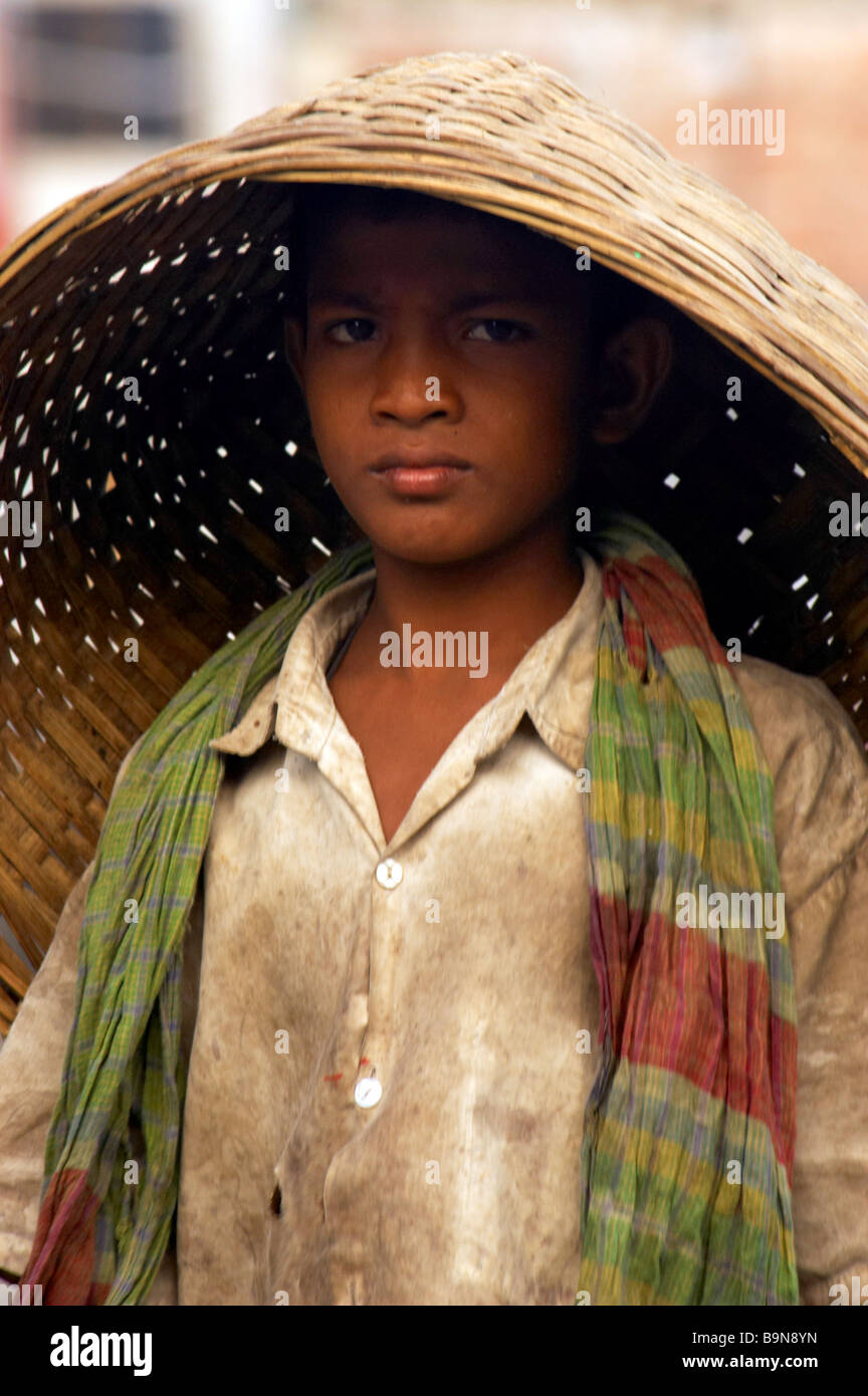 boy hard work child labor basket poverty job Stock Photo