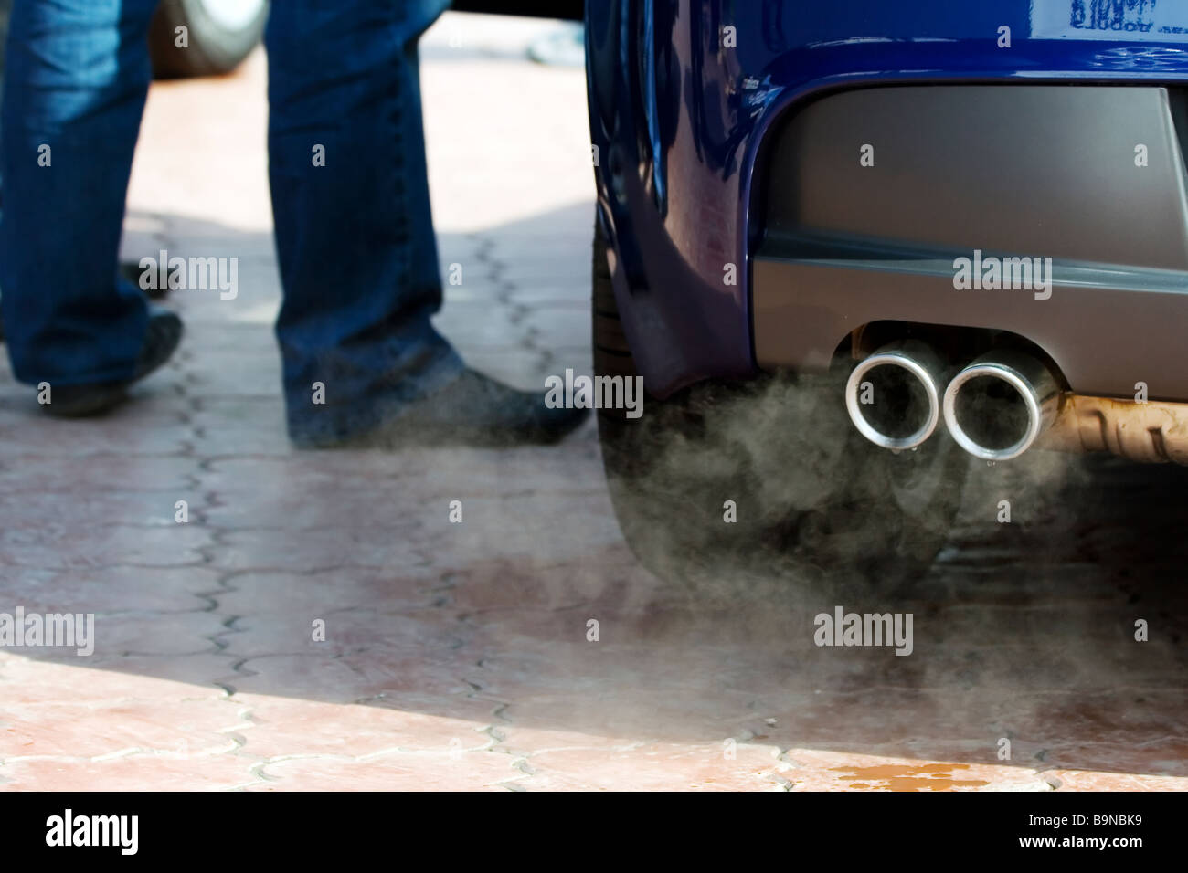 Exhaust pipe and waste gases. Stock Photo