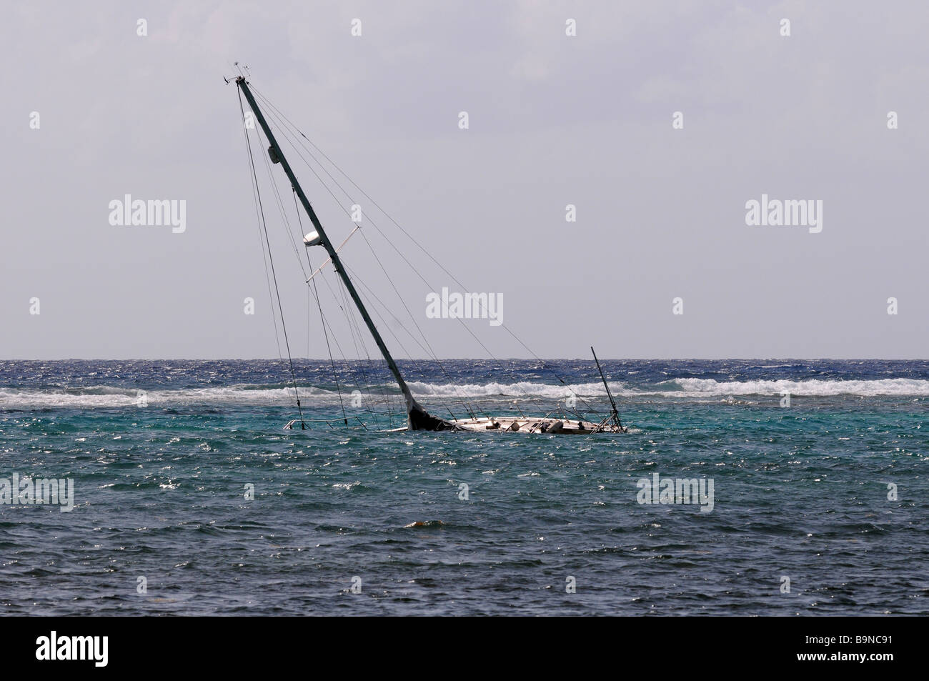 A sunken yacht off the coast of Mexico destroyed by the hurricane, natural disaster becoming more common due to climate change. Stock Photo