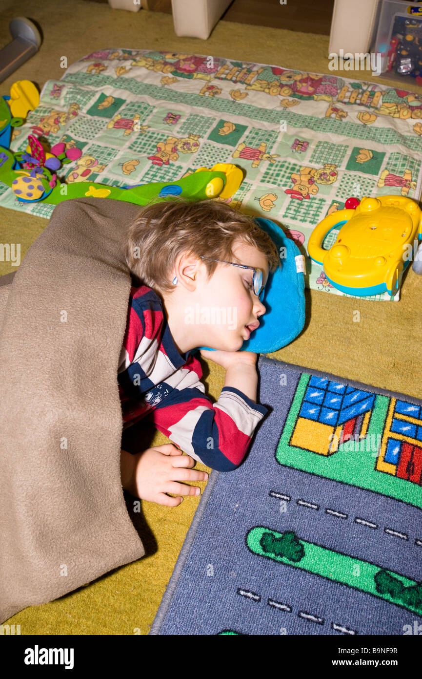 Boy sleep sleeping floor hires stock photography and images Alamy