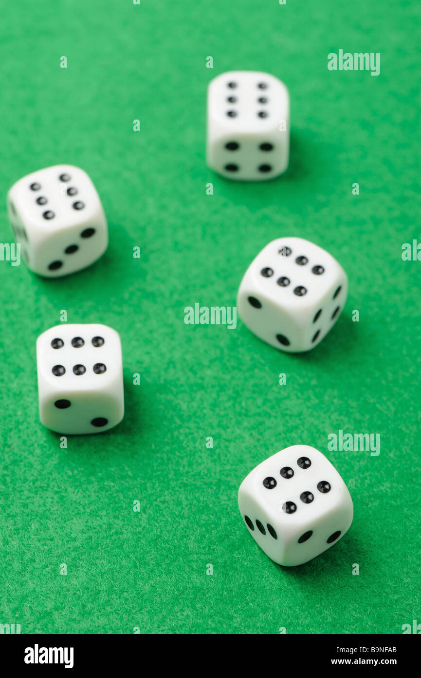 dices Game cubes on a green background Stock Photo Alamy