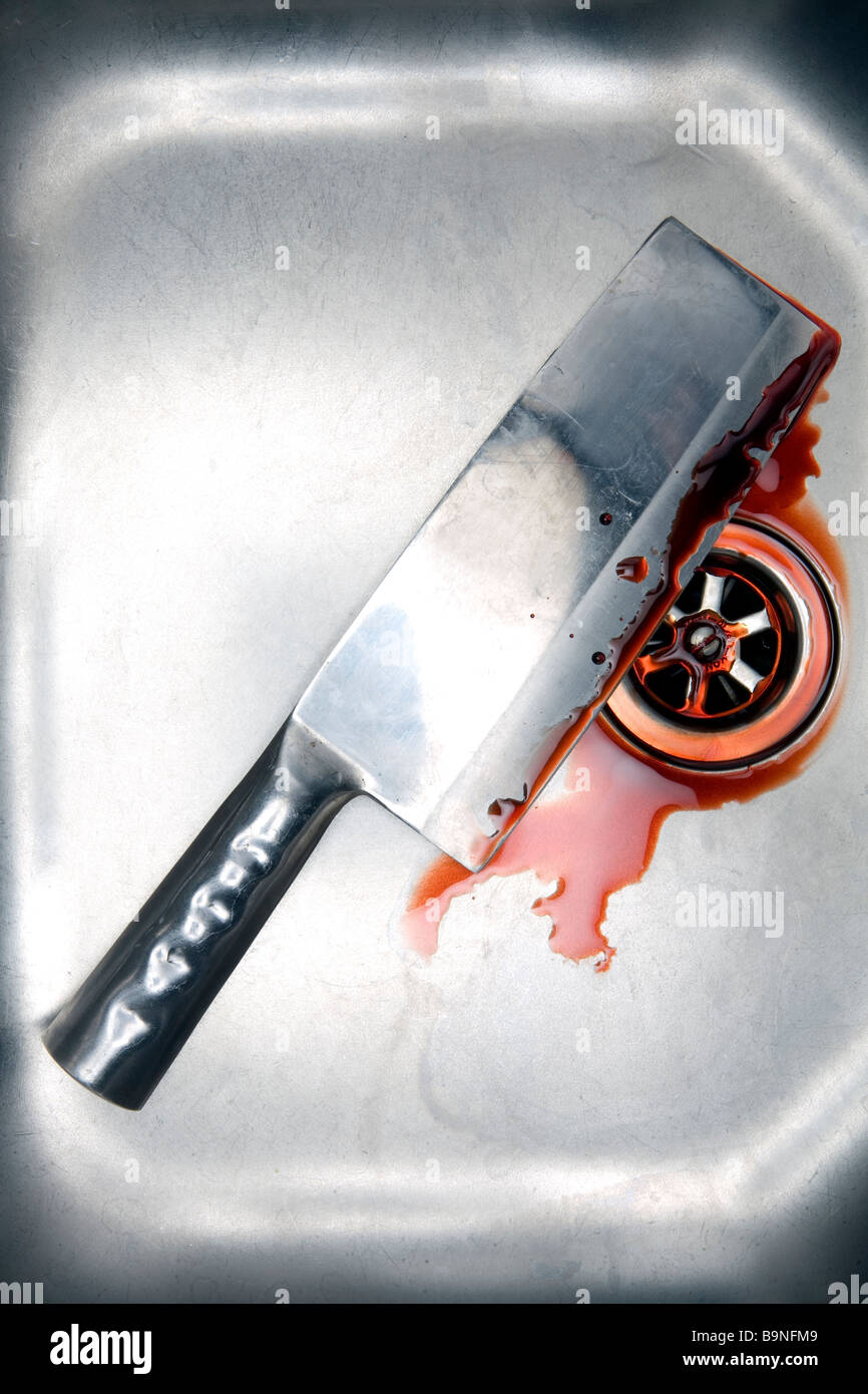 meat cleaver in sink with blood Stock Photo