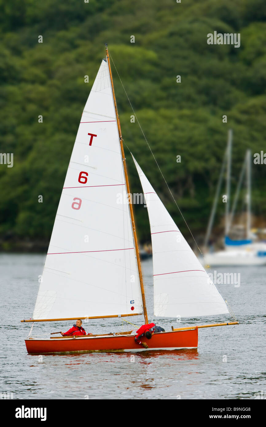 Troy class sailing boat in River Fowey estuary heads out to sea Stock