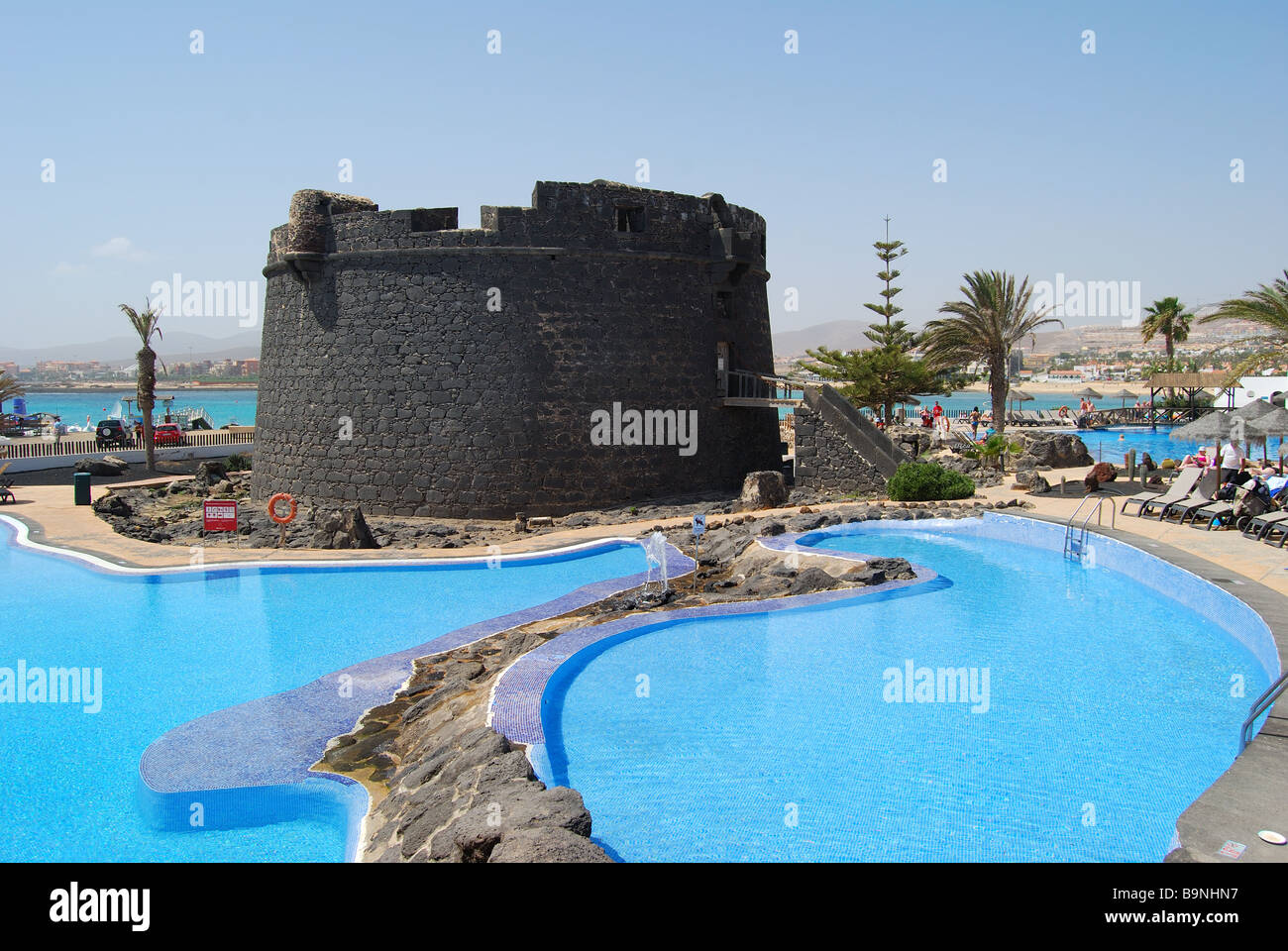 18th Century Castle and hotel pool, Barcelo Club El Castillo, Caleta de Fuste, Fuerteventura, Canary Islands, Spain Stock Photo