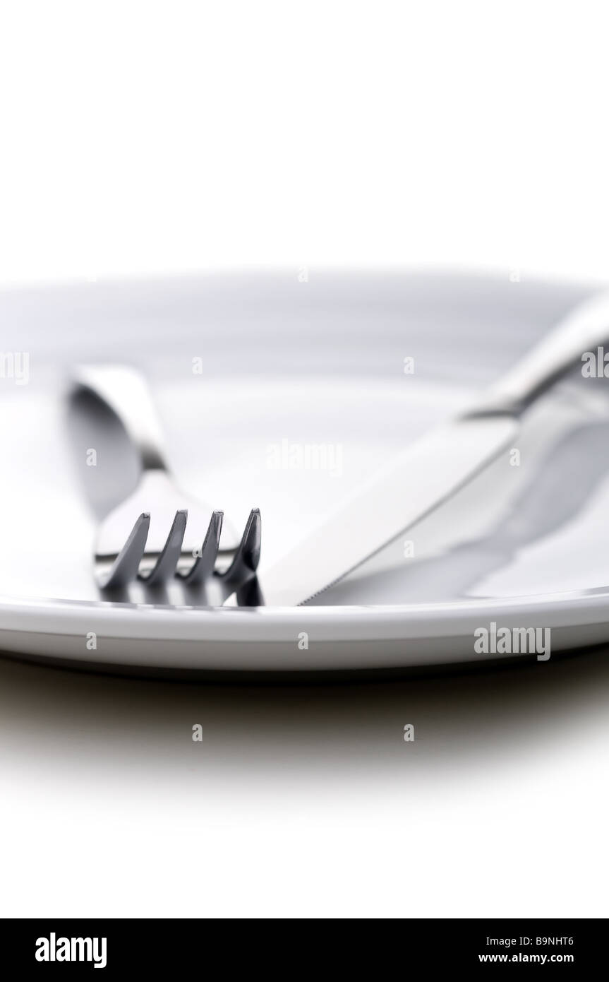 shallow focus silverware on a plate Stock Photo