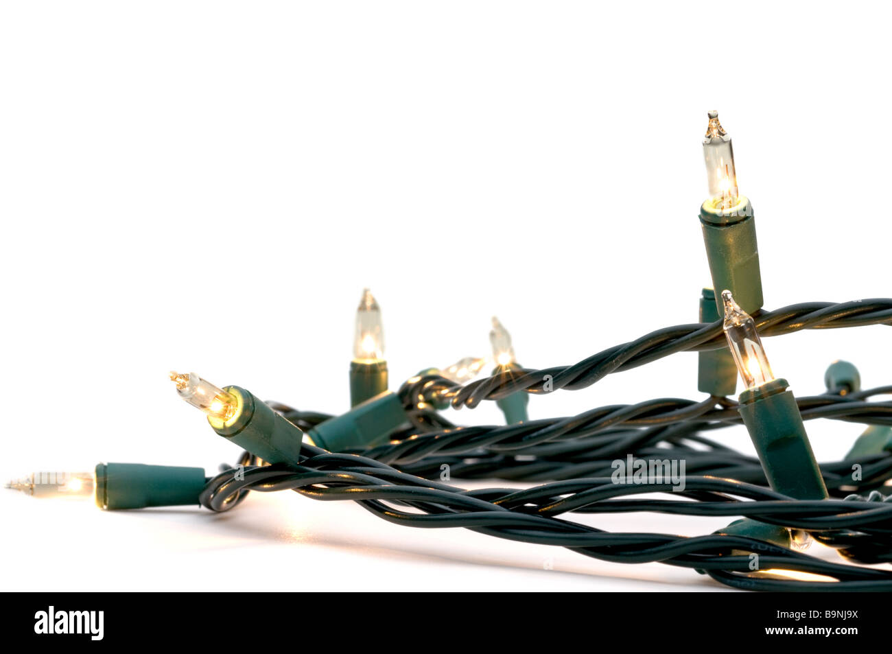 Clear white holiday lights with green cables Stock Photo Alamy