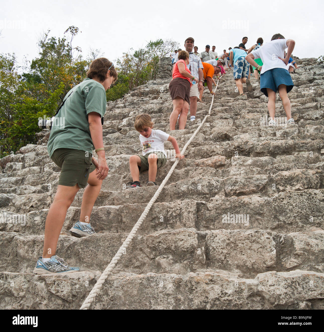 Mexico Yucatan - Coba Mayan historic ruins complex  - climbing the Nohoch Mul pyramid Stock Photo