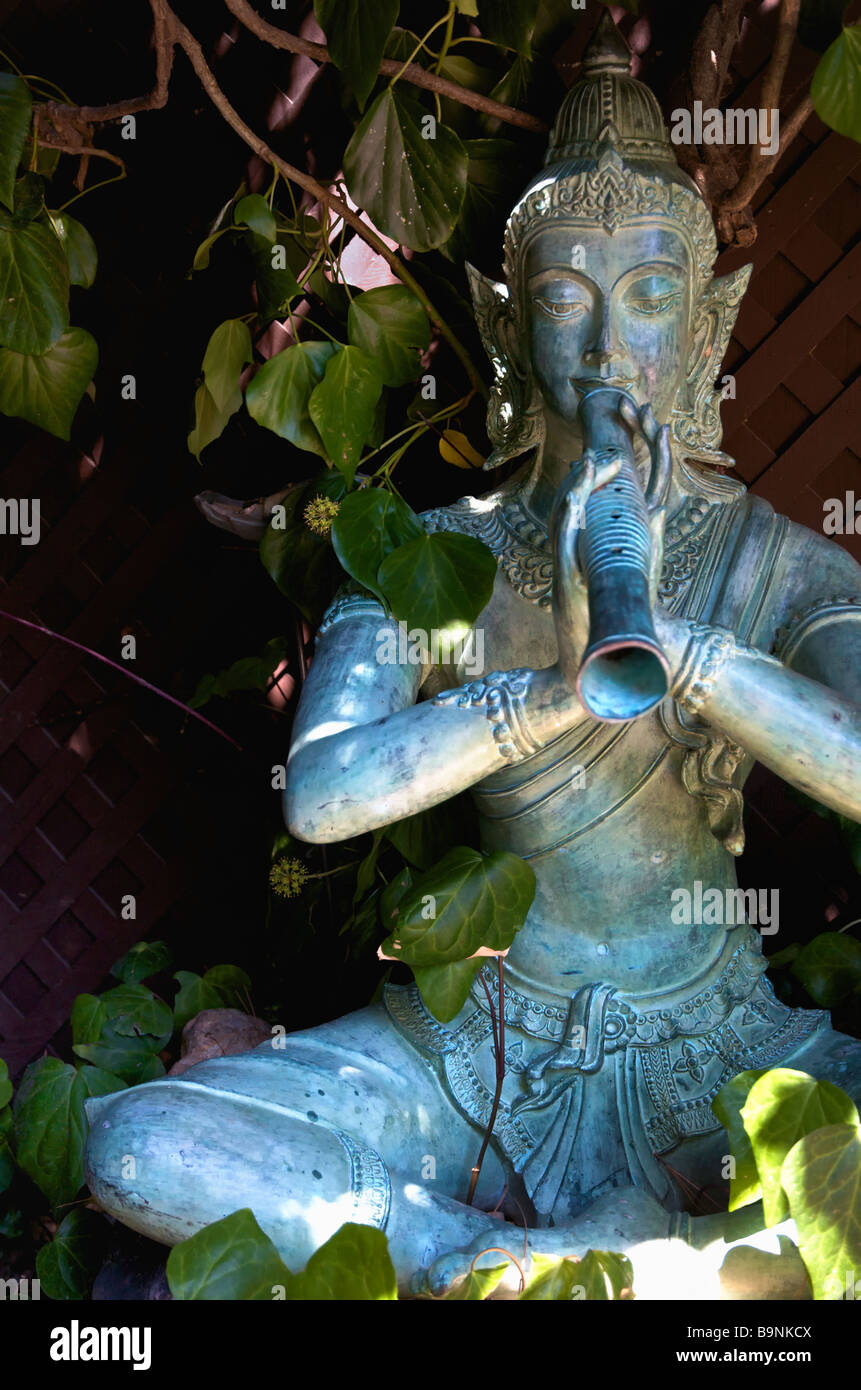 Krishna statue in garden setting hires stock photography and images