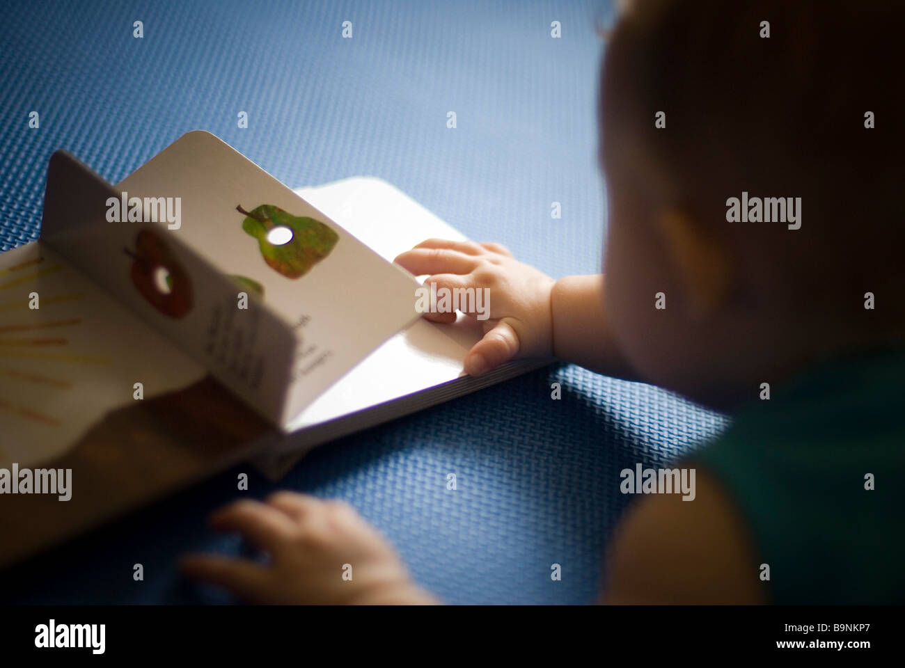 Baby reading a book Stock Photo