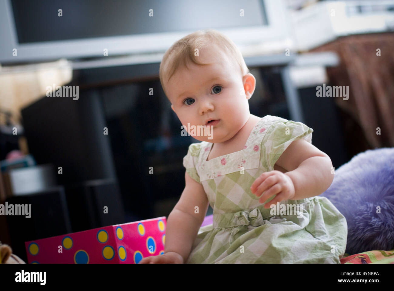 Baby girl at home Stock Photo