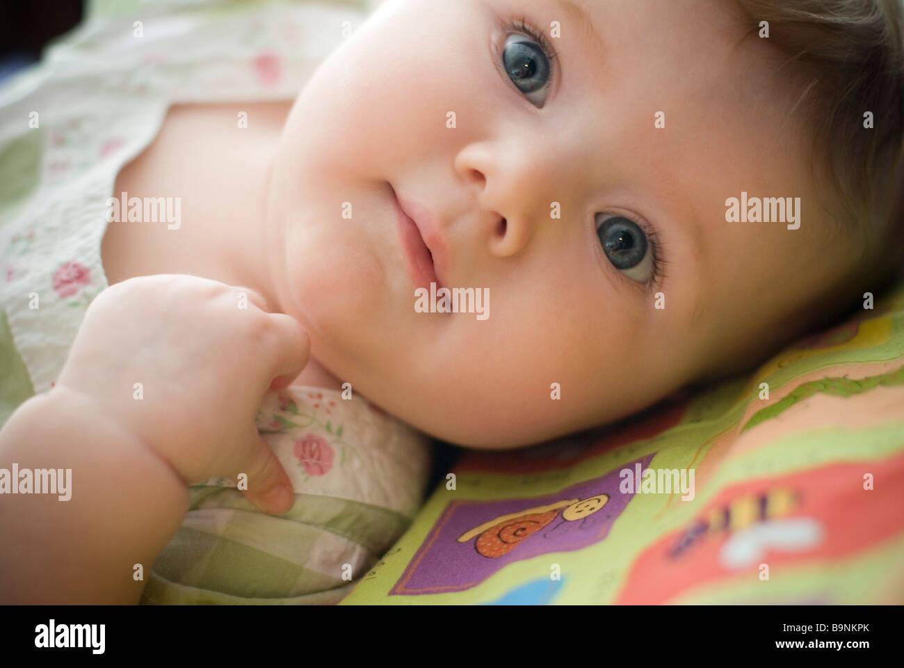 Baby girl lying down Stock Photo