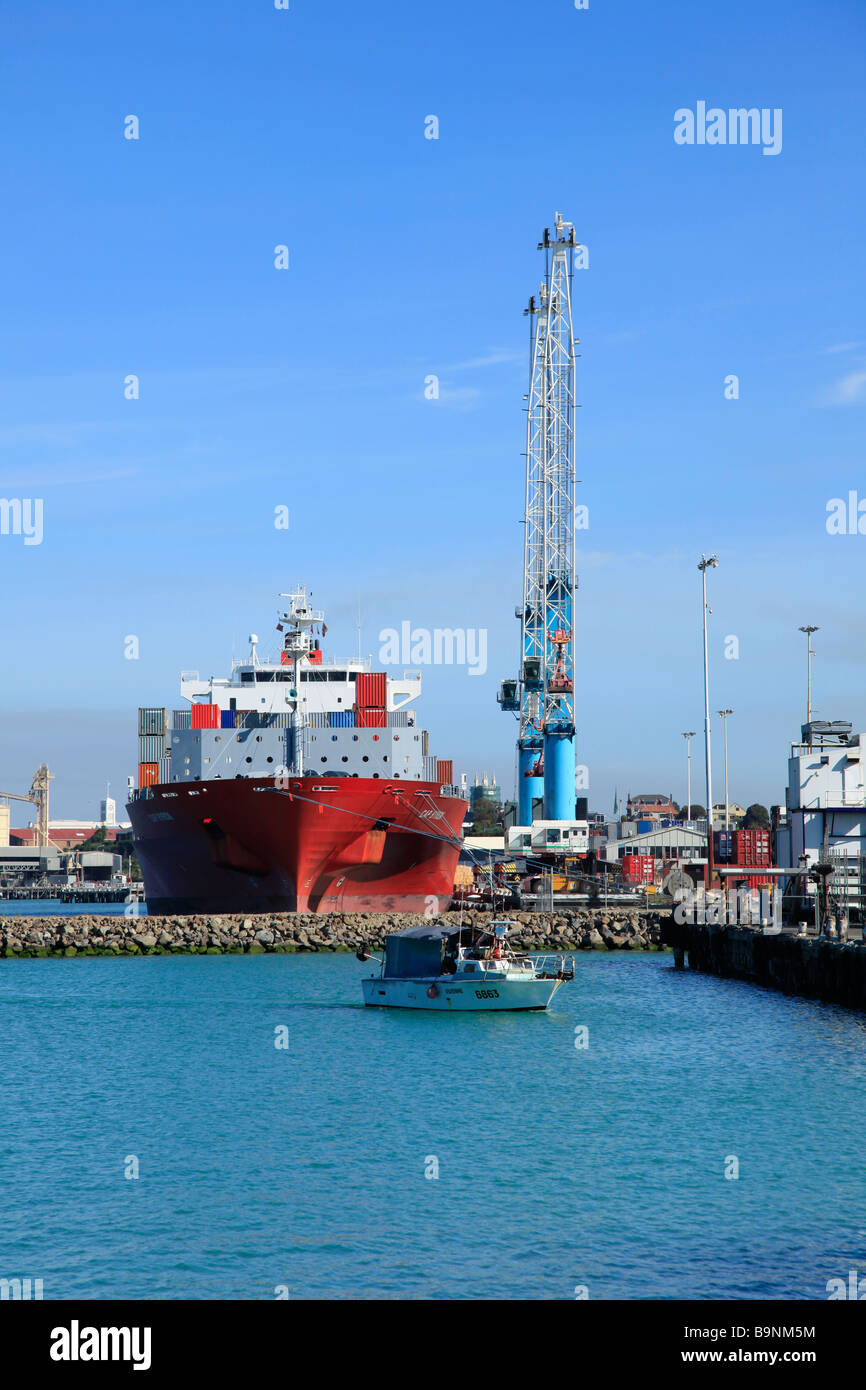 Cranes loading container ship in Prime Port,Timaru,Canterbury, South Island,New Zealand Stock Photo