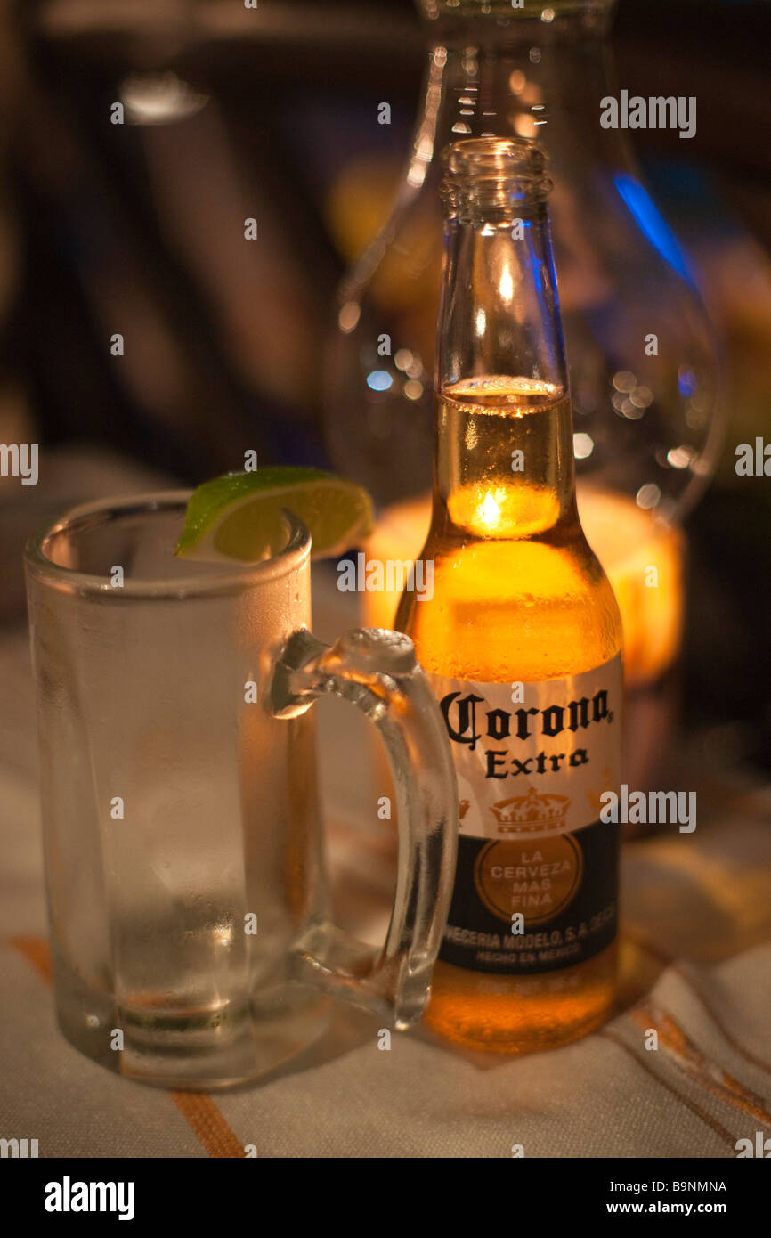 Mexico Yucatan 2009 Corona Extra beer by candelight outdoors at night Stock Photo