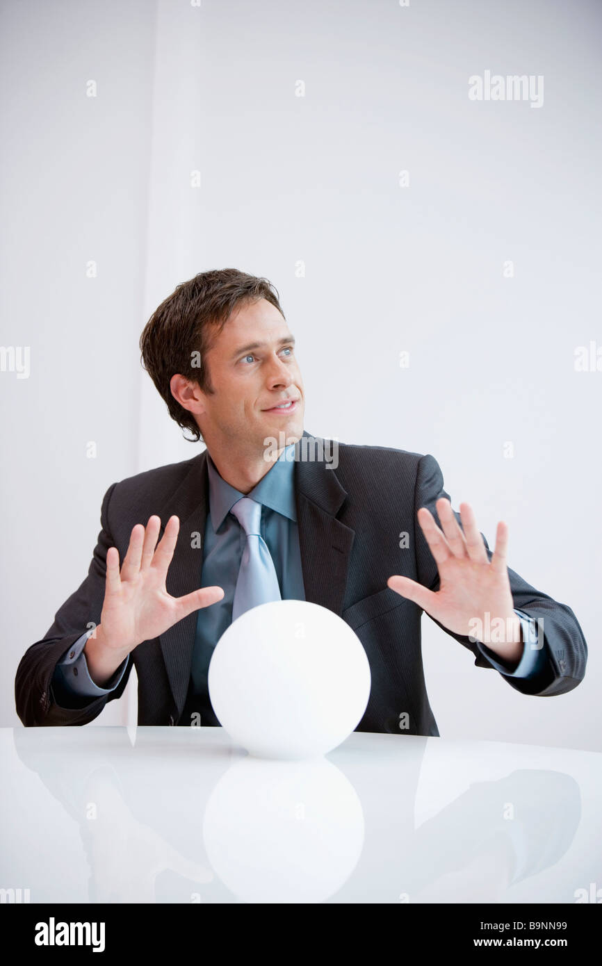 portrait of businessman with crystal ball Stock Photo - Alamy