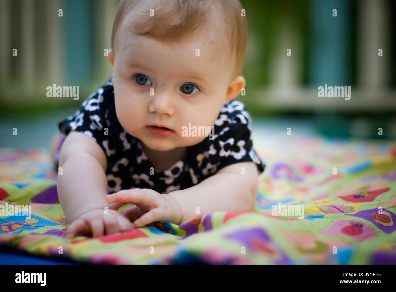 Baby lying on blanket Stock Photo