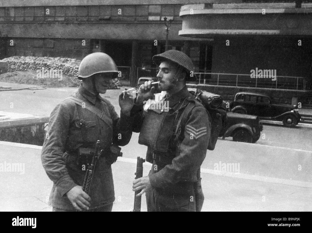 Soviet and British soldiers meet near the editorial office of the ...