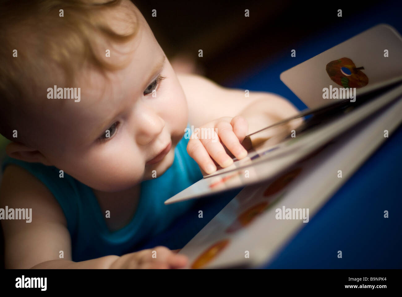 Baby reading book Stock Photo