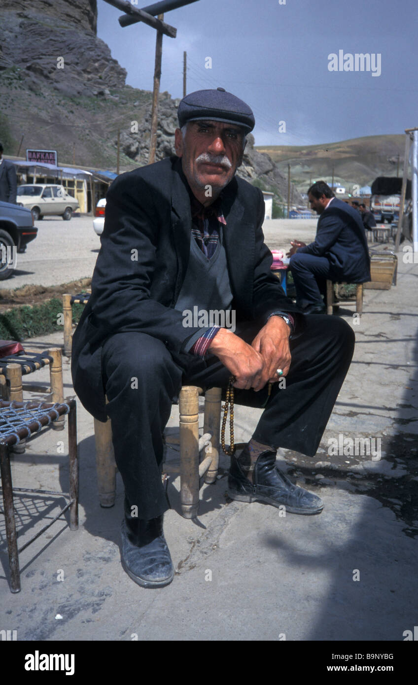 Kurdish man teahouse below castle eastern Turkey Stock Photo