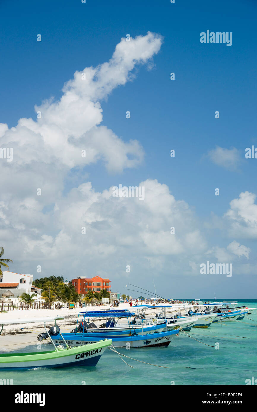 Mexican Riviera Yucatan, Puerto Morelos near Cancun - the beach with fishing boats and small hotels Stock Photo