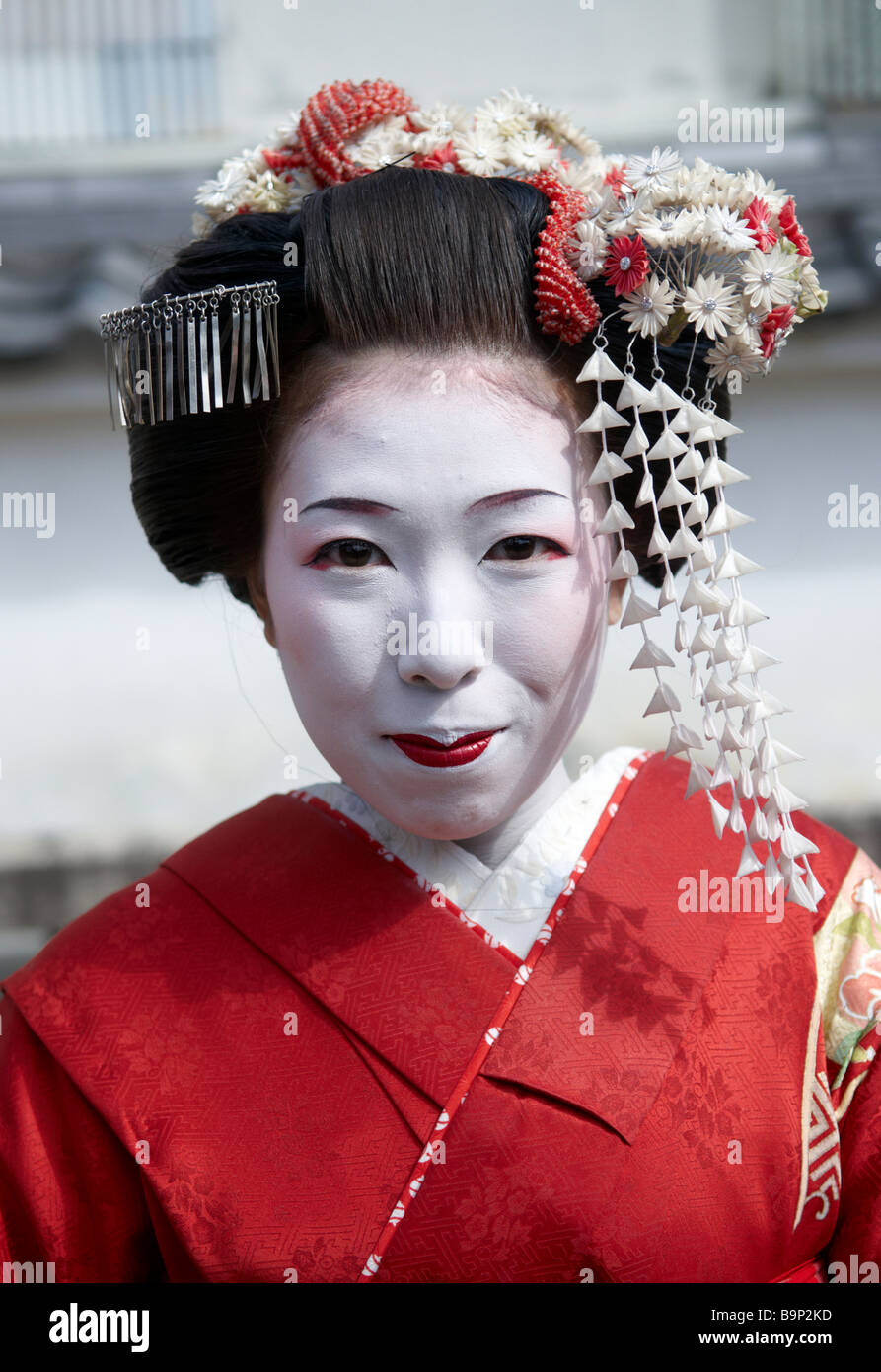 A Maiko (trainee Geisha) poses for the camera in Kyoto. Japan Stock Photo