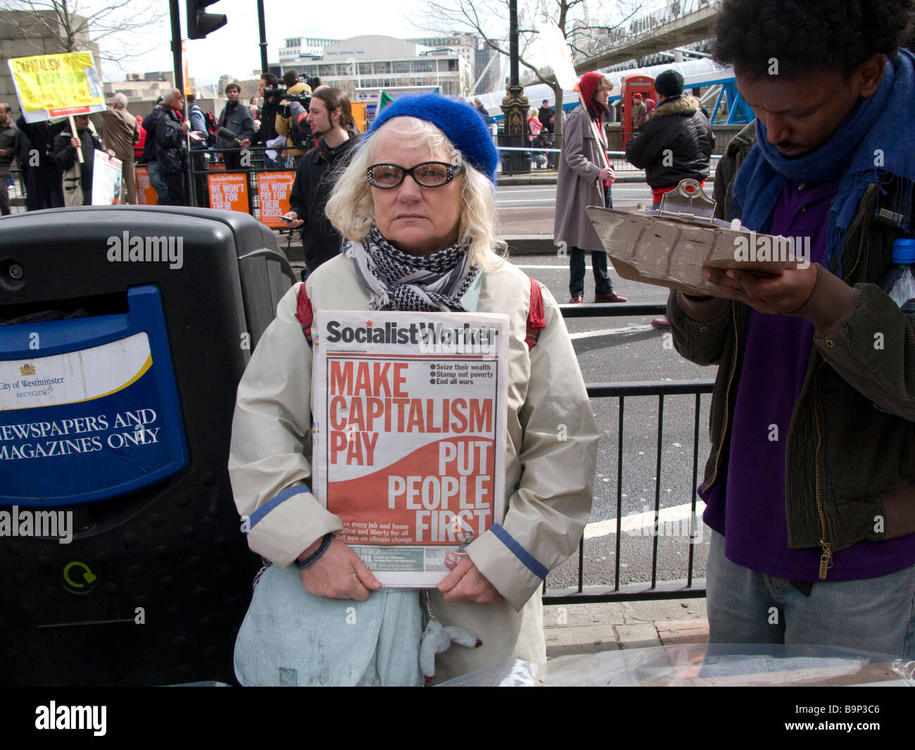 Socialist Worker newspaper seller at G20 protest march in central London, 28/03/09. Stock Photo
