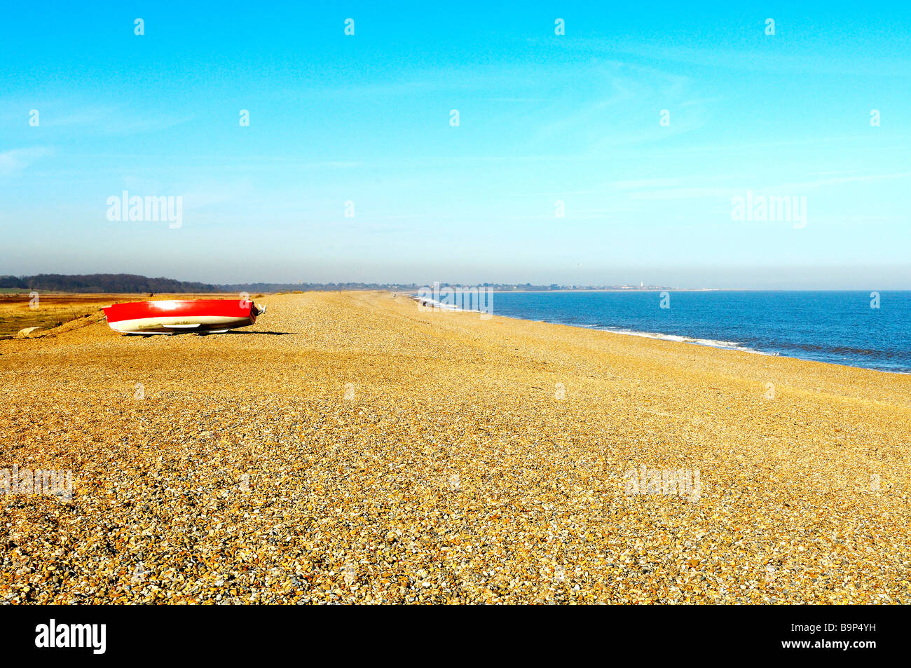 Rowboat On Beach At Dunwich, Suffolk, England Stock Photo