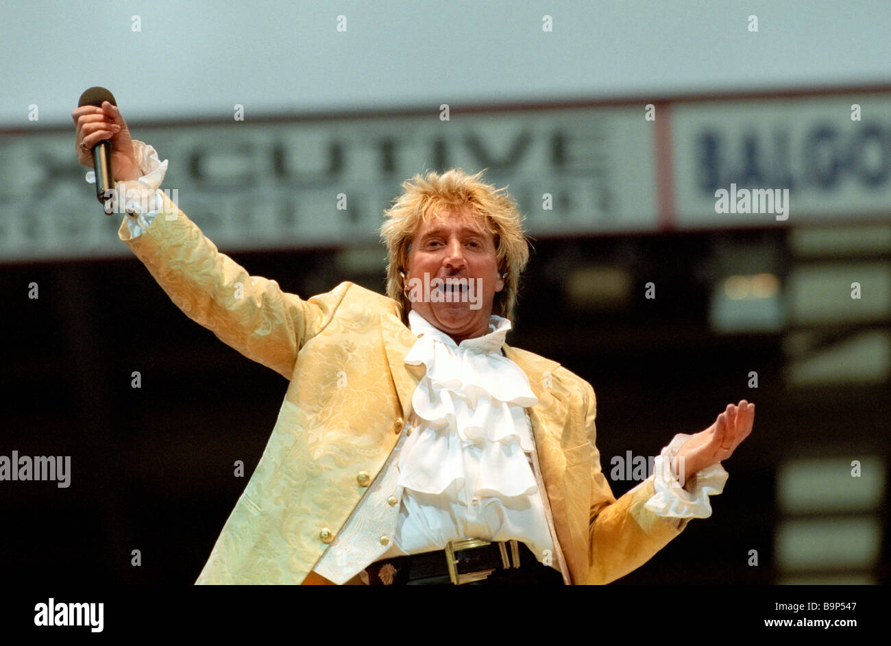 Rock singer Rod Stewart performing in concert at Pittodrie football stadium in Aberdeen in Scotland in 1995 Stock Photo