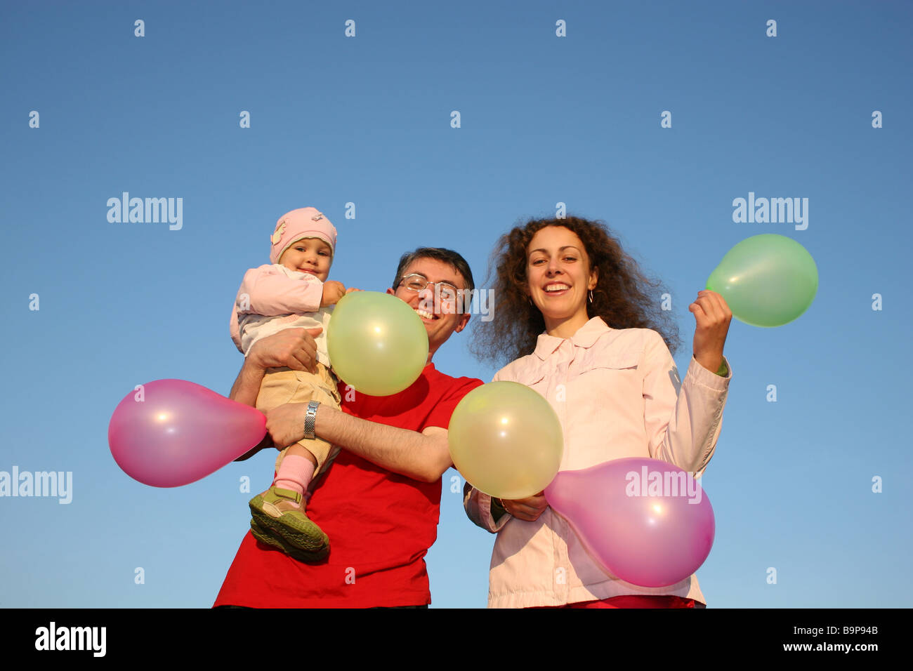 family with baby and balloons Stock Photo - Alamy
