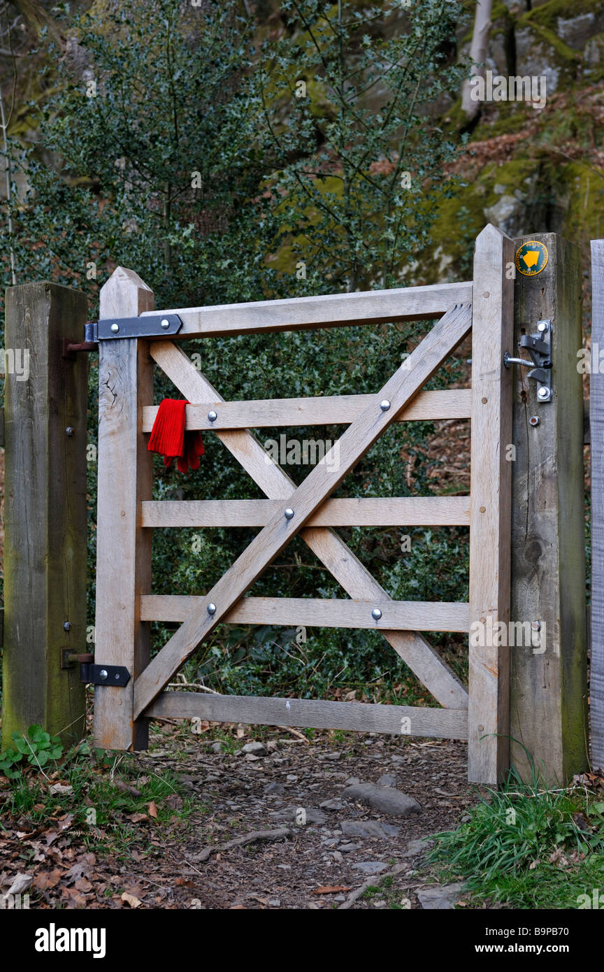 Lost, red, woollen glove on wooden gate. Craggy Plantation, Staveley