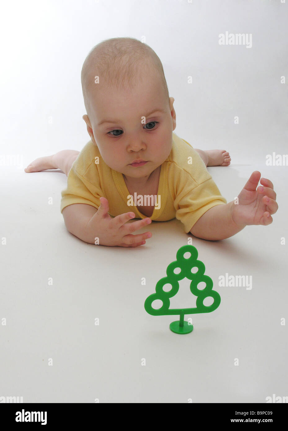  baby and small tree Stock Photo - Alamy