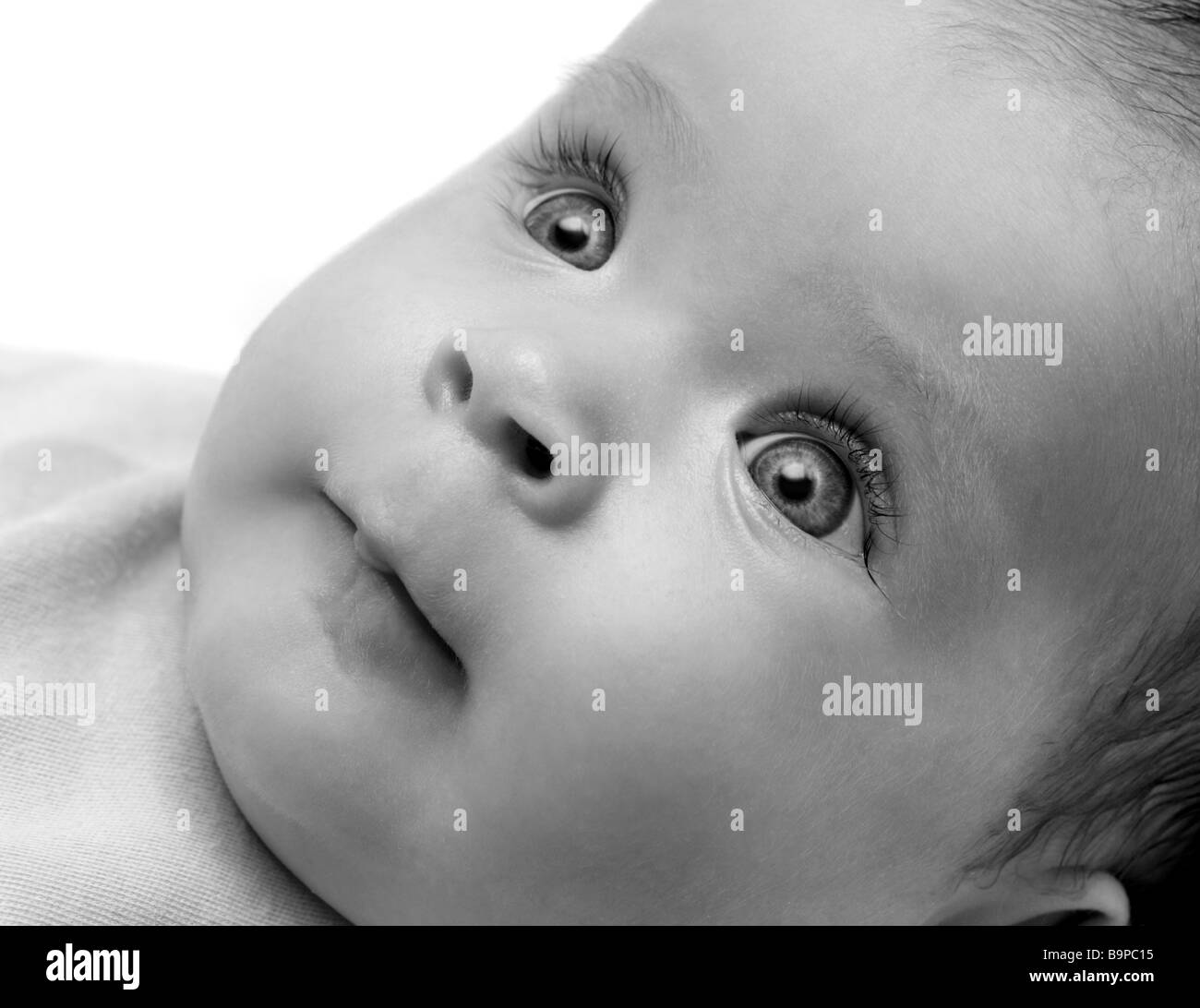 looking newborn baby girl close up portrait Stock Photo