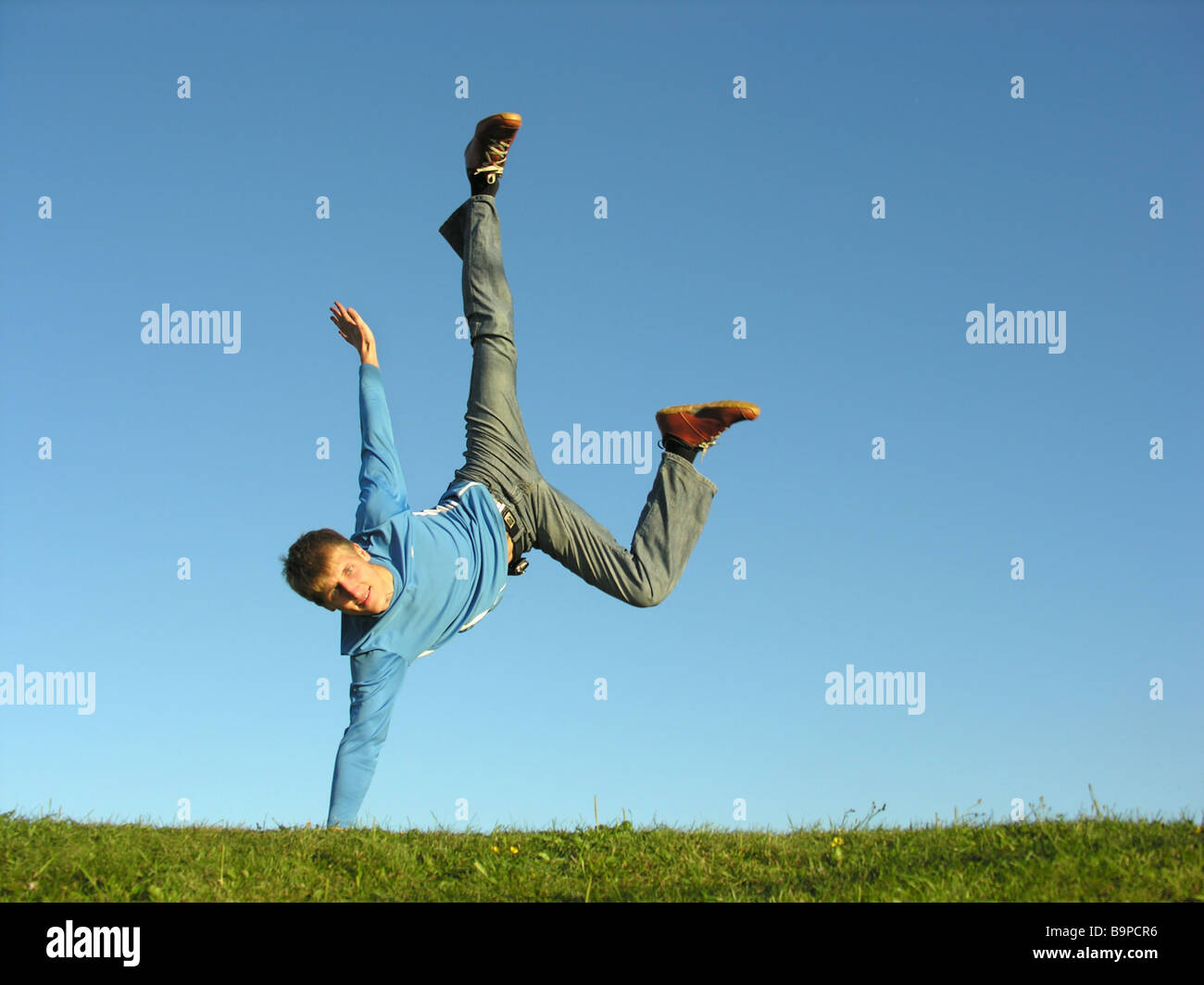 man on hands on blue sky 2 Stock Photo - Alamy