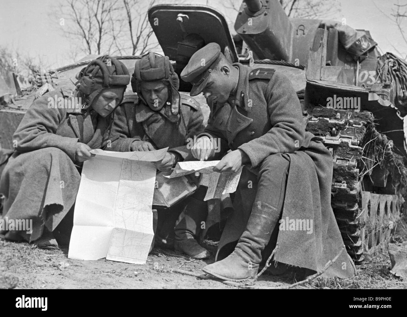 Tankmen discussing the route Stock Photo - Alamy