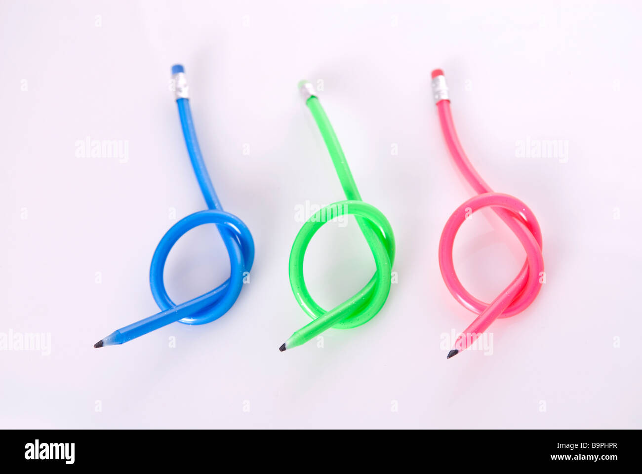 Flexible Pencil On A Turquoise Notebook Bent Pencils Twocolor Stock Photo -  Download Image Now - iStock