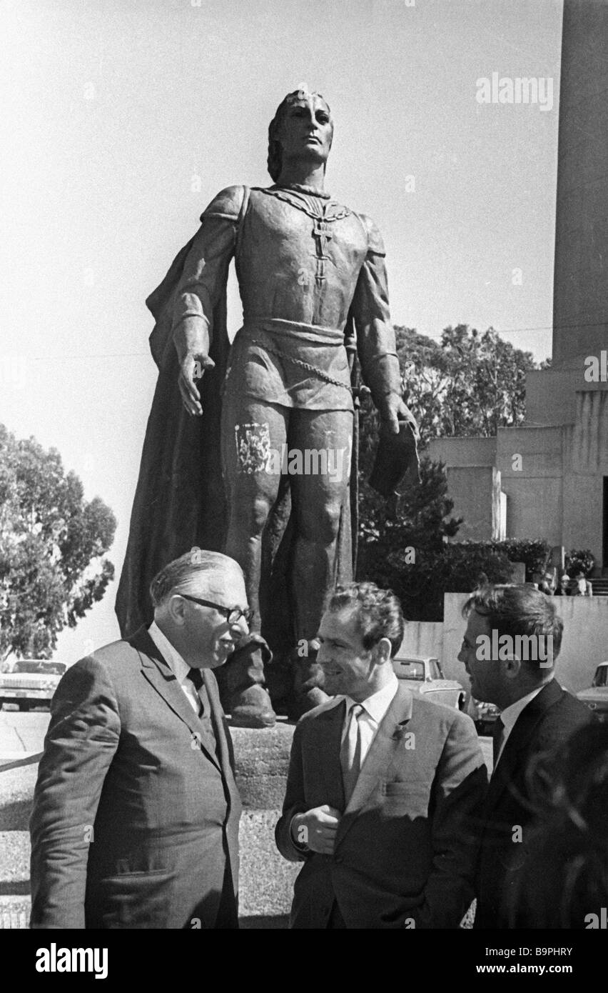 Soviet cosmonaut Gherman Titov center listening to a guide near the ...