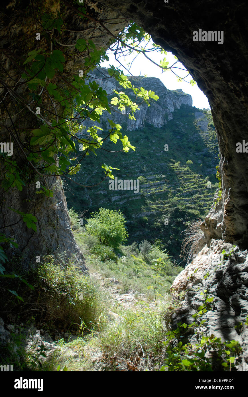 looking out of a cave off a Mozarabic trail, Vall de Laguart, Benimaurell, Alicante Province, Comunidad Valenciana, Spain Stock Photo