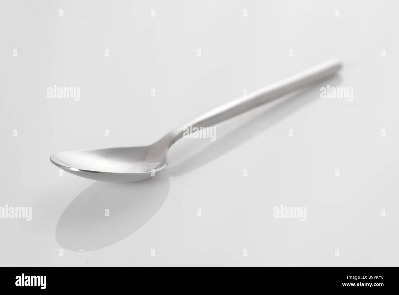 Eating spoon on a white background Stock Photo