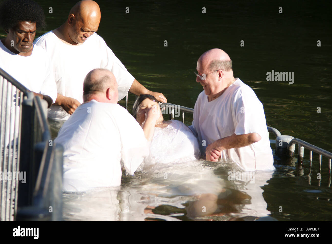 Israel Yardenit Baptismal Site In the Jordan River Near the Sea of Galilee A group of pilgrims