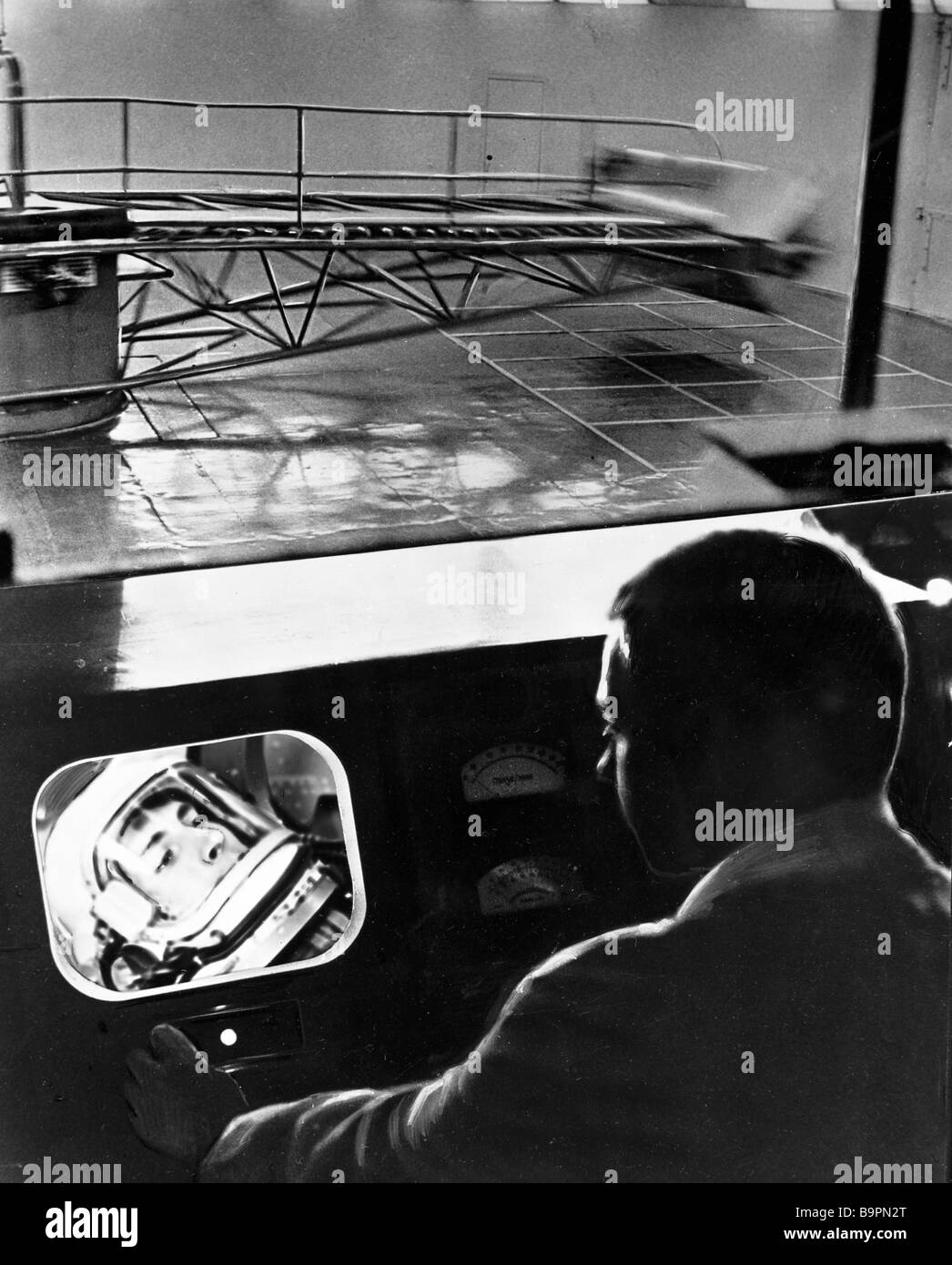 Plane Testing Rotation A pilot testing space outfit in a rotating machine Stock Photo - Alamy