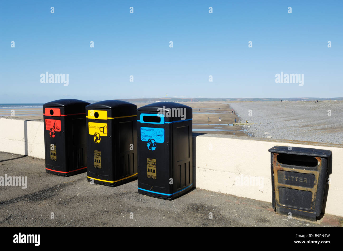 Recycling bins on the seafront of Westward Ho!, Devon, England. Stock Photo