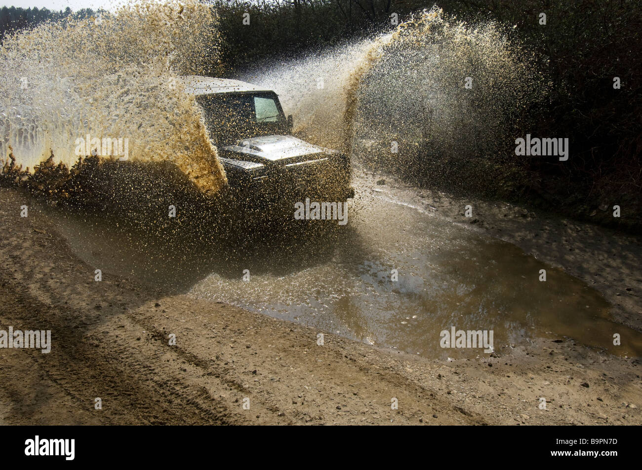 A Land Rover Defender 90 on an offroad trail Stock Photo