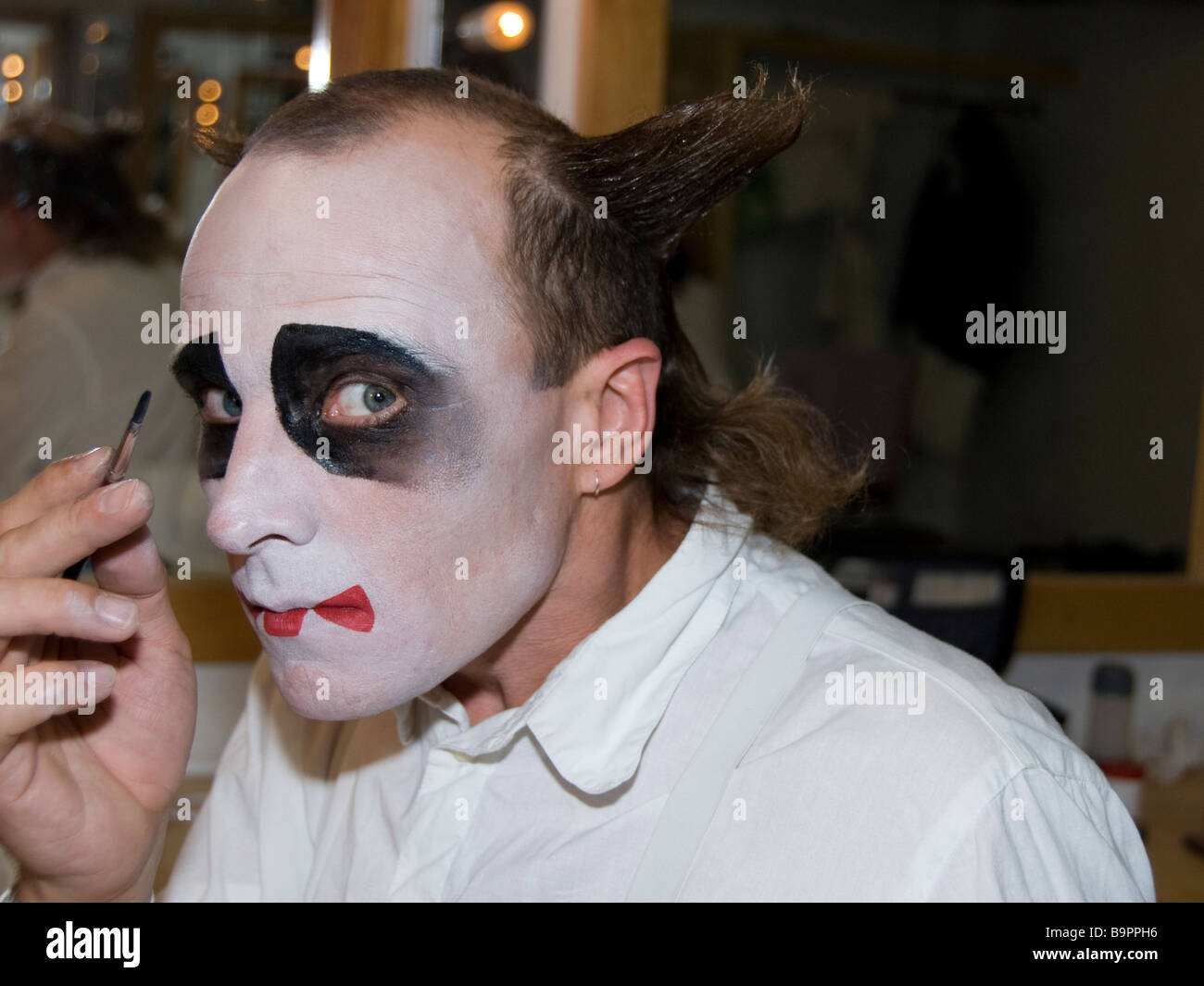 A Clown Applying Makeup Stock Photo Alamy