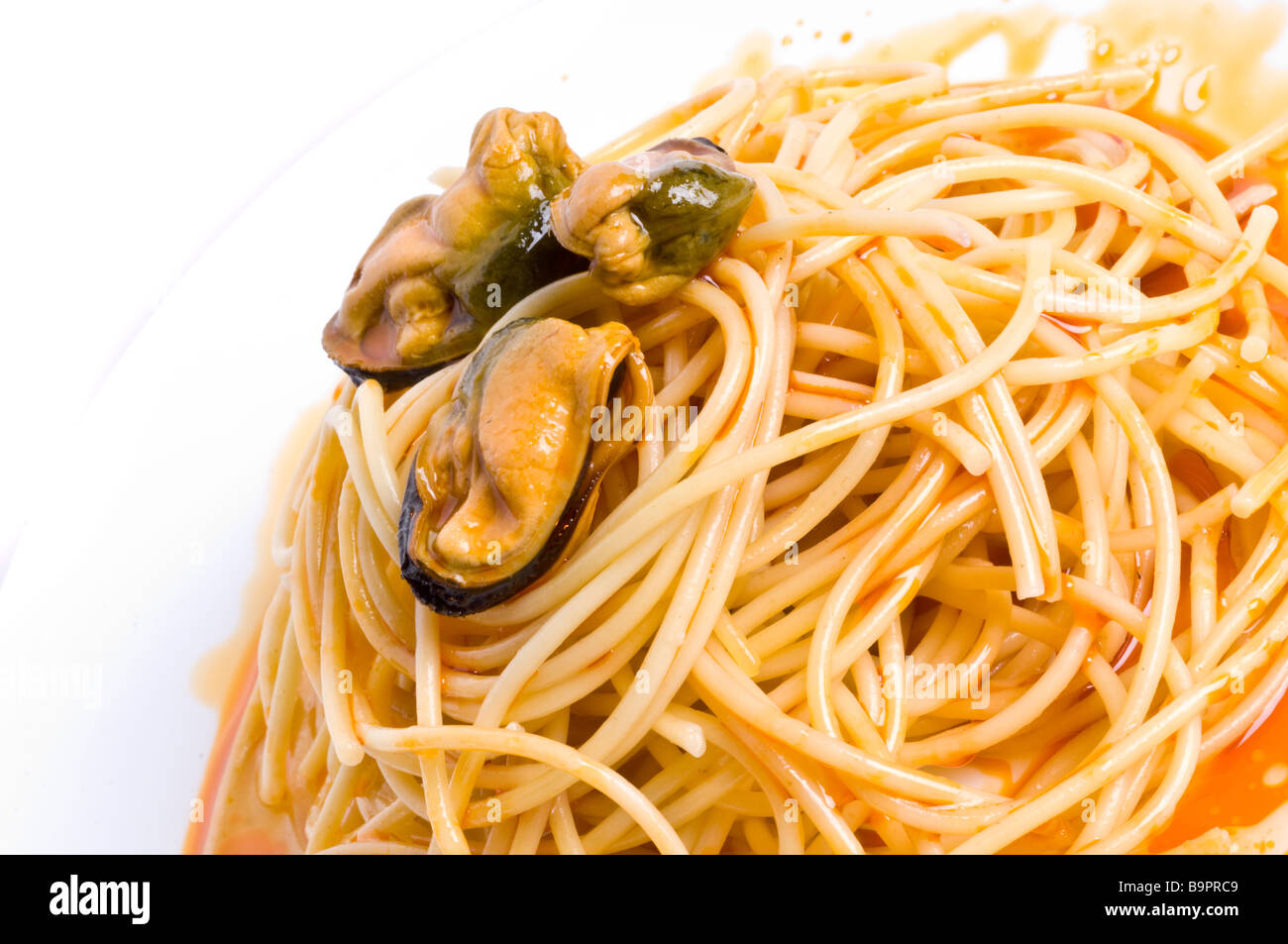 Mussels in red sauce Stock Photo Alamy