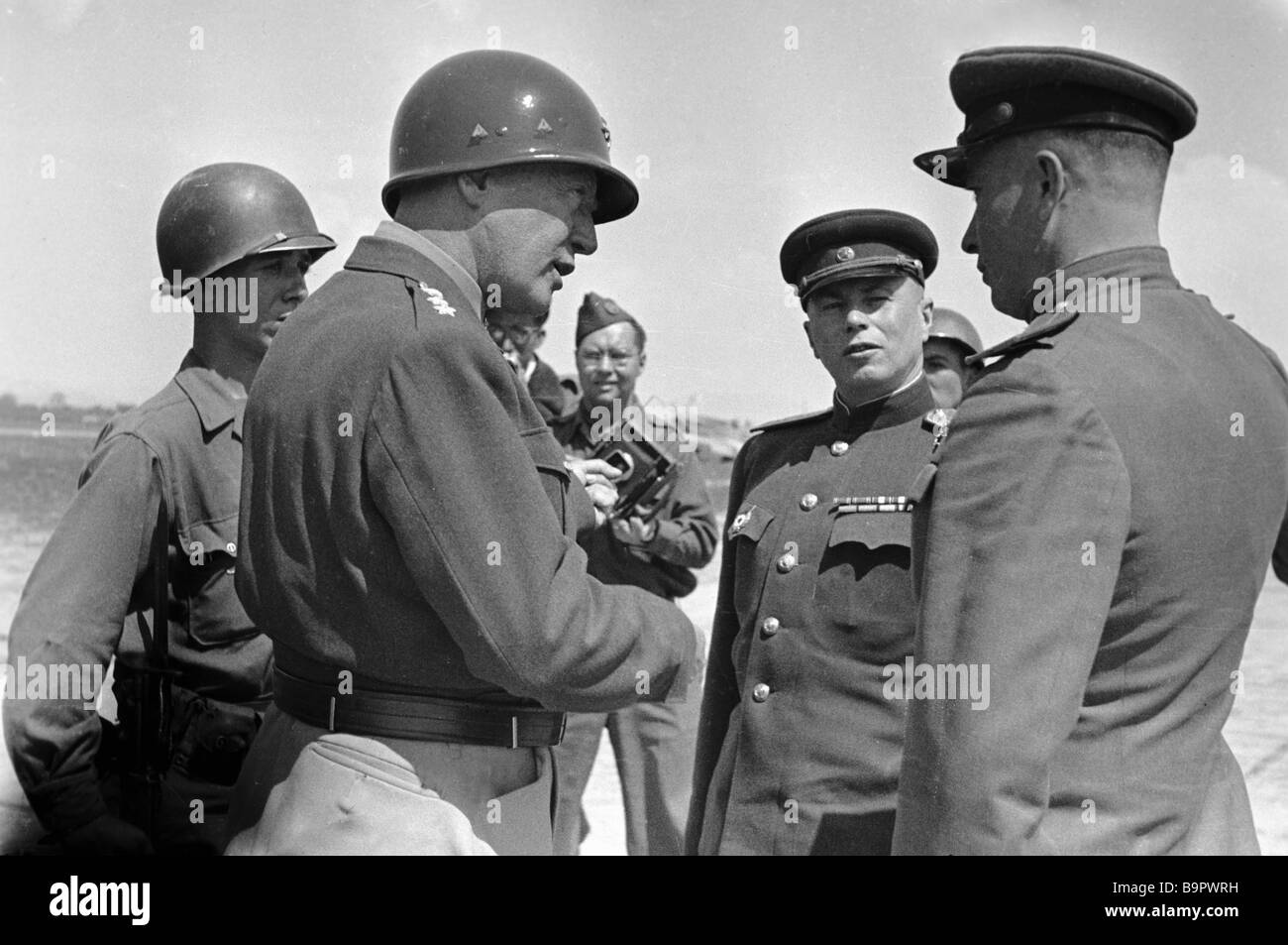 Soviet generals talking to American officers at a German airfield Stock ...
