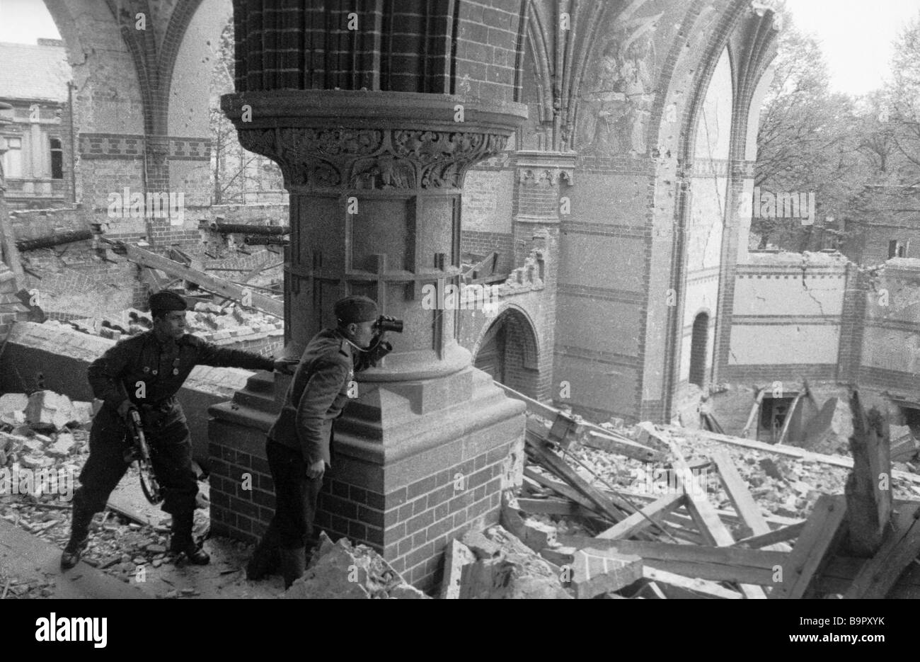 A Soviet officer spotting artillery fire in destroyed Berlin Stock